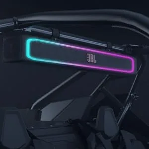 Vehicle dashboard or windshield display showing glowing purple and blue LED light strips or interface elements against a dark background.