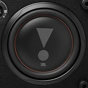 Text reads 'JBL'. Black circular speaker driver with exclamation point symbol in center, featuring red accent ring and metallic mesh cone.
