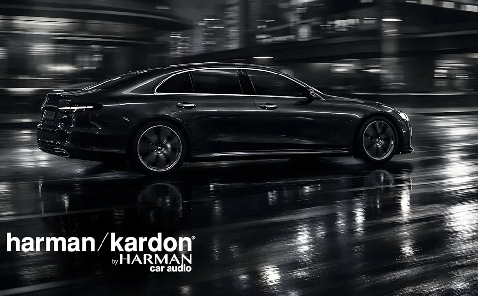 Text reads 'harman/kardon'. Dramatic black and white photography of luxury vehicle in rain-slicked environment, shown from multiple angles.